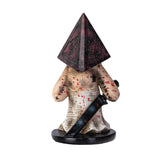 Figurine with pyramid-shaped head and sword on a white background