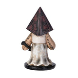 Figurine with pyramid-shaped head and long coat on a white background