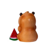 Peanut-shaped salt and pepper shaker with a watermelon slice on a white background