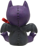 Purple and black creature with wings and a red object on a white background