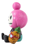 Toy figure with pink spherical head and pineapple, on a white background