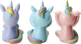 Three colorful unicorn figurines in different colors on a white background