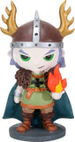 A chibi-style collectible figurine of a Viking warrior with antlers, a green tunic, brown fur details, and a blue cape, holding a small flame on a white background.