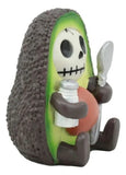 Avocado-shaped toy with a skeleton character holding a spoon and bottle.
