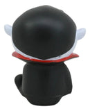 Black figurine with a red collar on a white background