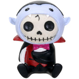 Skeleton figurine with a red cape on a white background