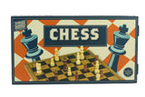 Wooden Games Workshop Chess board game box, featuring a vintage-style illustration of a chessboard with pieces and large chess pieces on an orange and cream checkered background.