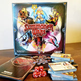 Summoner Wars board game set with packaging and components on a wooden surface