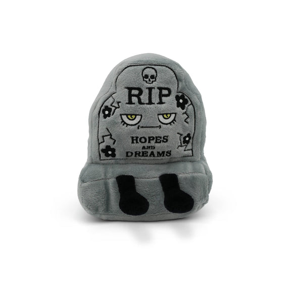 Gray plush toy resembling a tombstone with text and skull designs on a white background