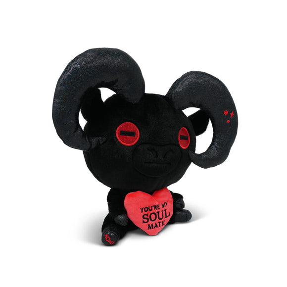 Black plush toy with red eyes and a heart-shaped tag on a white background
