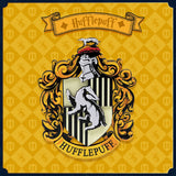 Hufflepuff house crest with decorative elements on a yellow background