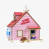 Pink house with 'Kame House' sign and character on a white background