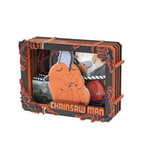 Chainsaw Man-themed product packaging with character illustrations and branding.