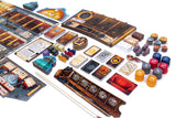Collection of board game components including cards, dice, and game pieces on a white background