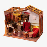 Miniature model of a room with furniture and decor, resembling a cozy living space.
