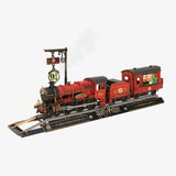 Model train set with red engine and black tender on a white background