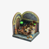 A miniature Harry Potter wooden model kit, featuring an open archway scene with potion cauldrons, bookshelves, broomsticks, and spells, on a light gray background.