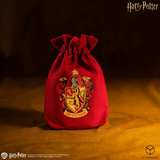 Red drawstring bag with Gryffindor crest on a dark background