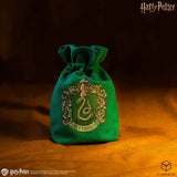Green drawstring bag with Slytherin emblem on a dark background
