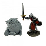 Figurine of a knight with a sword and a creature on a white background