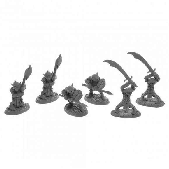 Set of gray miniature figures with various weapons on a white background