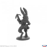 Gray rabbit-like figurine with a weapon on a white background