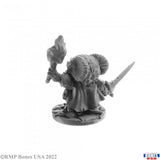 Gray miniature figure with a weapon on a white background