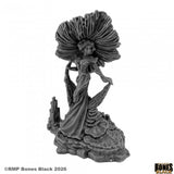 Dark fantasy figurine with flowing hair and gown on a white background