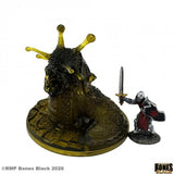 Miniature figurine of a creature with yellow horns and a warrior holding a sword on a white background.