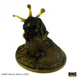 Dark fantasy figurine with gold accents on a white background