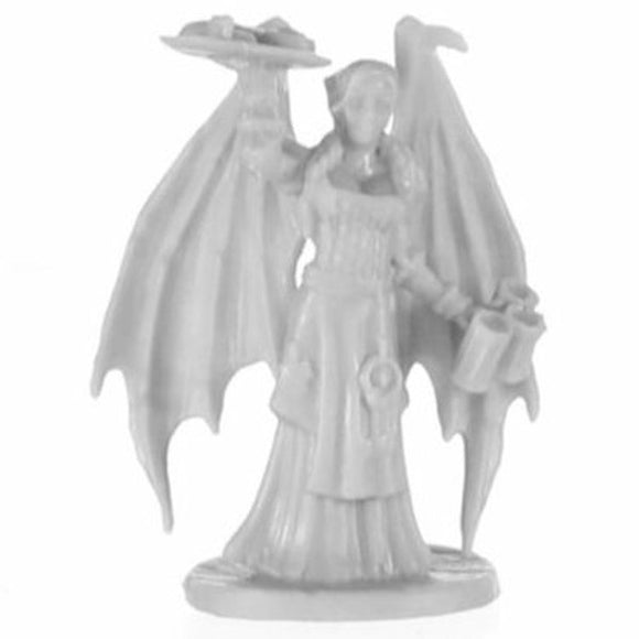 White angel figurine with outstretched wings on a white background