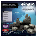 Heroscape game components packaging with mountain-like structures and text on a blue background