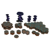 Collection of miniature terrain pieces on a white background