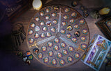 Round metal board with various compartments and decorative elements on a wooden surface.