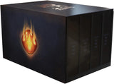 A boxed set of four dark books or volumes with a black cover, featuring a glowing orange flame-like emblem on the front and the title 'The Age of Ash' printed near the top.