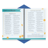 Open spiral-bound book with text and lists on a white background