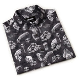 Black shirt with white skull and skeleton pattern on a white background