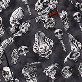 Pattern of stylized skulls and bones on a dark background