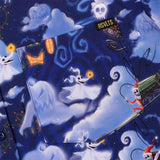 Halloween-themed shirt with ghost and skeleton designs on a blue background