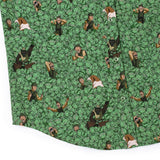 Patterned fabric with cartoon characters and green background