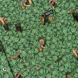 Pattern of a person lying on the ground with a bottle, surrounded by green leaves.