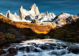 Scenic view of mountains with a river flowing in the foreground