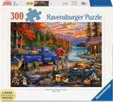 Ravensburger puzzle box with a scenic design of a campfire by a lake, blue truck, and people.