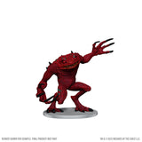 Red fantasy creature figurine on a white background