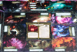 Collection of fantasy trading cards with intricate artwork and text on a dark surface.