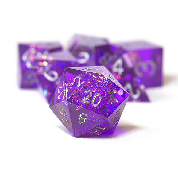 Purple polyhedral dice set on a white background