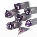 Purple polyhedral dice set on a white background