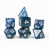 Set of blue and white polyhedral dice on a white background