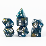Set of polyhedral dice with blue and gold marbled pattern on a white background