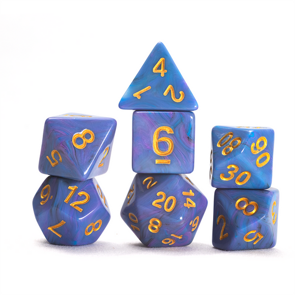 Set of blue and purple marbled dice with gold numbers on a white background